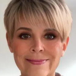 Psychic Patricia from Absolute Soul Secrets with short bobbed blonde hair and brown eyes