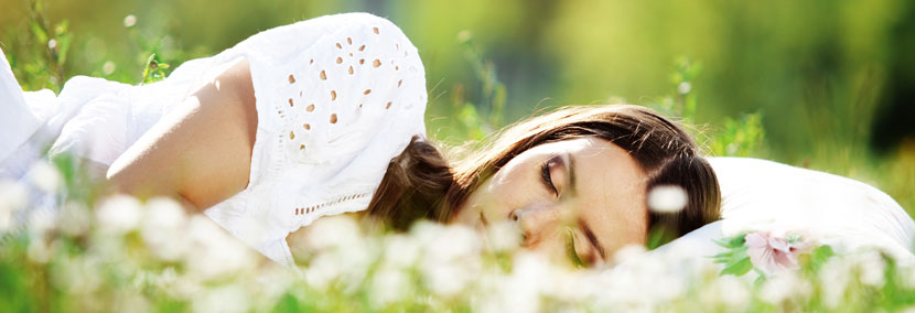 image of woman sleeping on the grass
