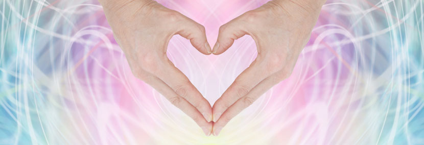 image of energy from hands on pink background