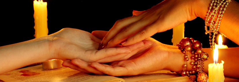 image of psychic using palmistry in psychic reading