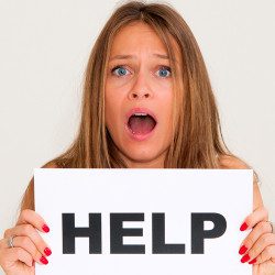 Image of woman with sign saying help!