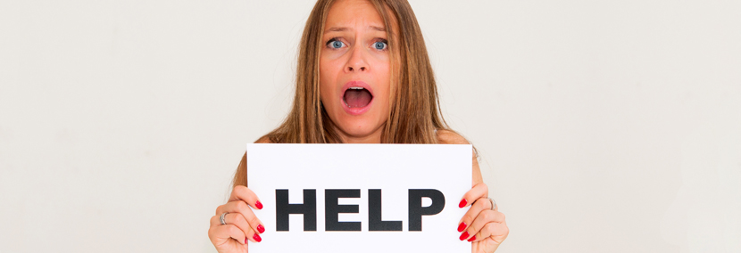 image of woman holding up a help sign