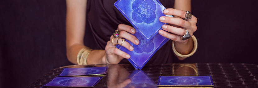 image of psychic laying out tarot cards