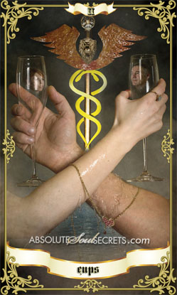 image of two hands entwined around the 2 of cups