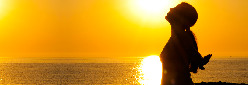 image of woman embracing an easy life in the sunset
