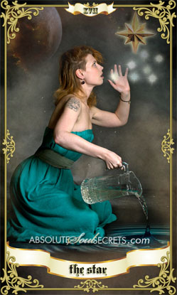image of a woman in a green dress looking at the star representing the tarot