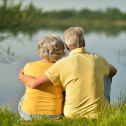image of a happy senior couple looking at a lake