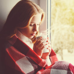 image of a woman in the cold winter feeling moody