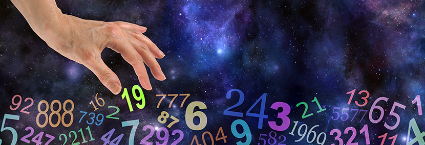 a hand choosing a number from multiple floating angel numbers