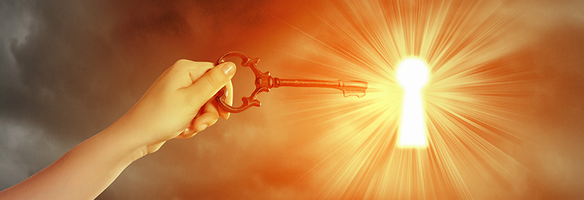 a bright starry orange background with a key unlocking a door in the sky