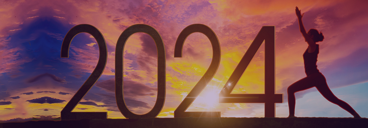silhouette of woman on a colourful sky in front of the year number 2024