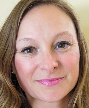 image of psychic xenia with light brown hair, long fringe and brown eyes wearing light pink lipstick