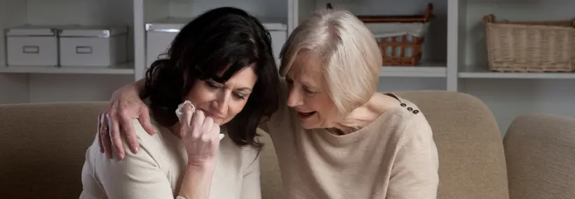 a woman coping with loss, the mother is consoling her