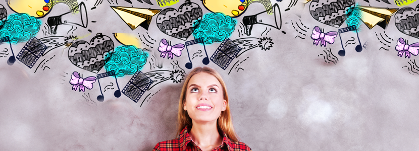 Smiling woman looking up at whimsical, colorful doodles symbolizing creativity and vision, representing the energy of Master Number 22 in numerology — the Master Builder in life