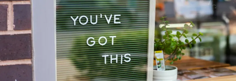 a very inspirational quote posted on a glass window, "You've got this."